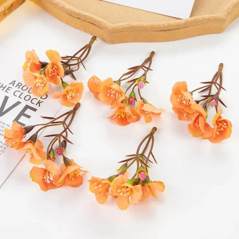 Vibrant orange artificial cherry blossom branches with delicate petals and pink buds for living room decorbites artificial flowers