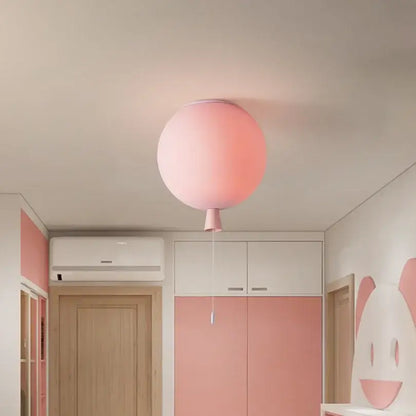Soft pink glossy balloon pendant light with subtle gradient and matching pull cord installation method for childrens bedroom