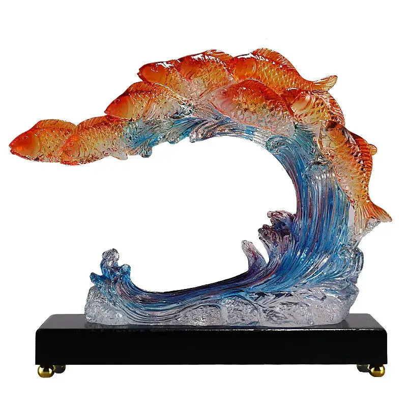 Vibrant gradient goldfish resin sculpture featuring orange and blue translucent fish on black base for living room decor