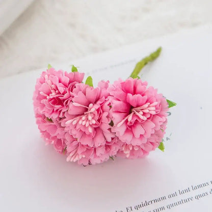 A cluster of delicate pink carnation stamen silk flowers with green stems and leaves for decorbites living room decor