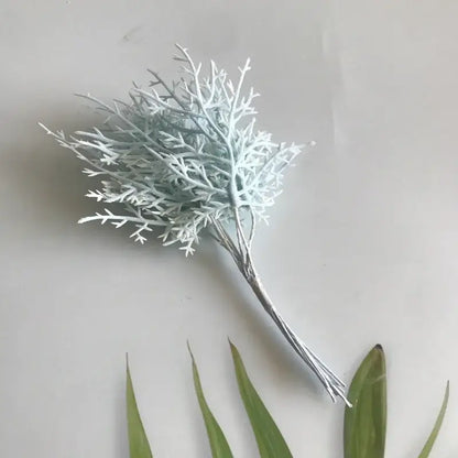 A delicate light blue artificial branch with textured feathery design and silver stems in vibrant dried flower bouquets