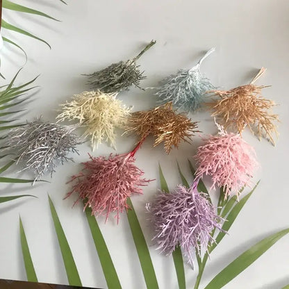 A collection of vibrant multicolored dried flower bouquets in a white vase crafted from synthetic fiber for living room decor