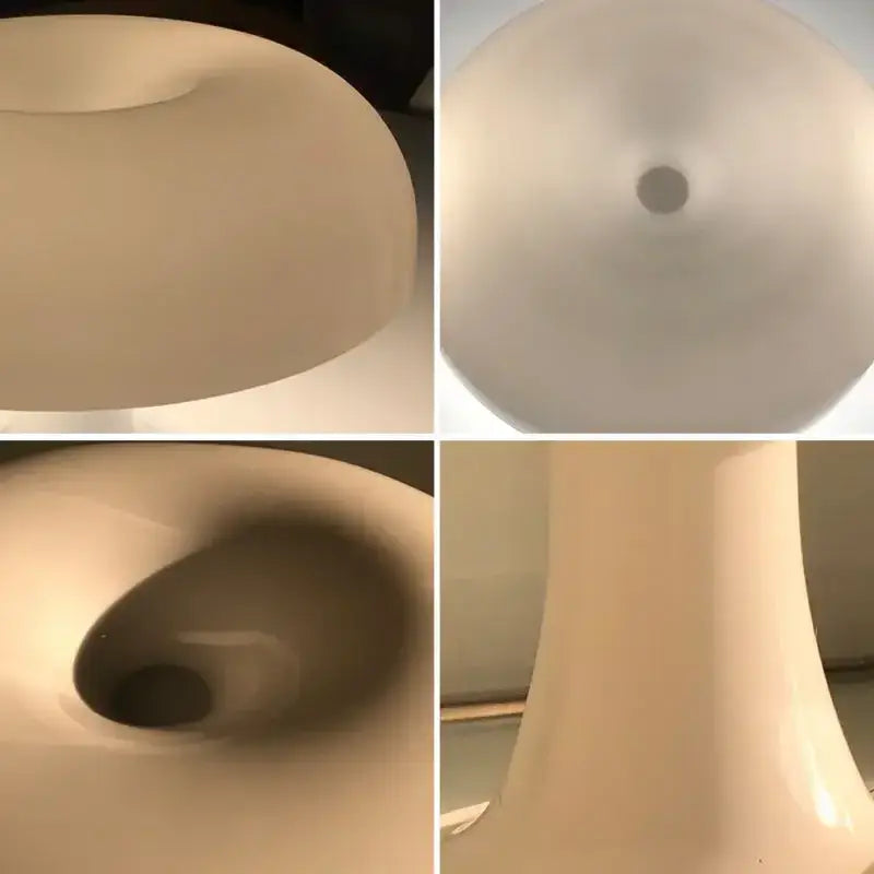 Cream-colored glossy ceramic toilet with modern minimalist design alongside vibrant orange mushroom desk night light
