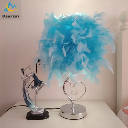 Blue feathered lamp with a heart-shaped metallic base and crystal accent decorbites crystal feather led table lamp