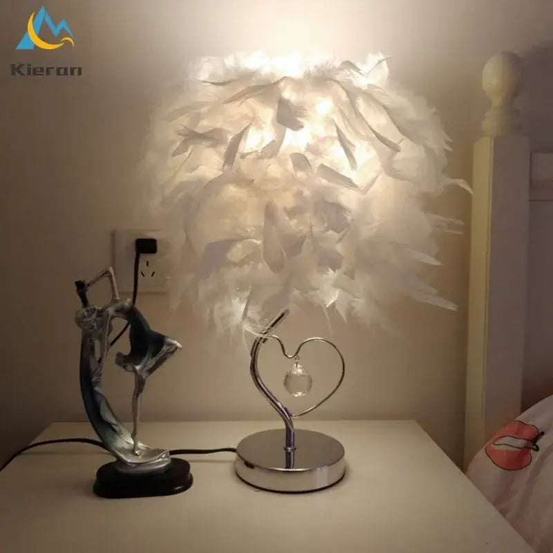 Vibrant pink crystal feather led table lamp with white feather shade, heart-shaped metallic base, and crystal accent for bedroom decorbites crystal feather