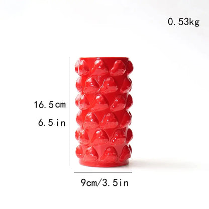 Vibrant red ceramic fruit relief vase with raised glossy strawberry bumps for kitchen decorbites fruit relief decor