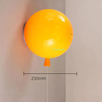 Vibrant yellow balloon lamps wall light with glossy finish and orange nozzle for bedroom decor and ambiance