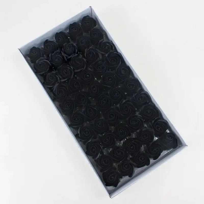 A box of glossy black rose-shaped soaps from the decorbites bath flower set for elegant bathroom decorbites bath