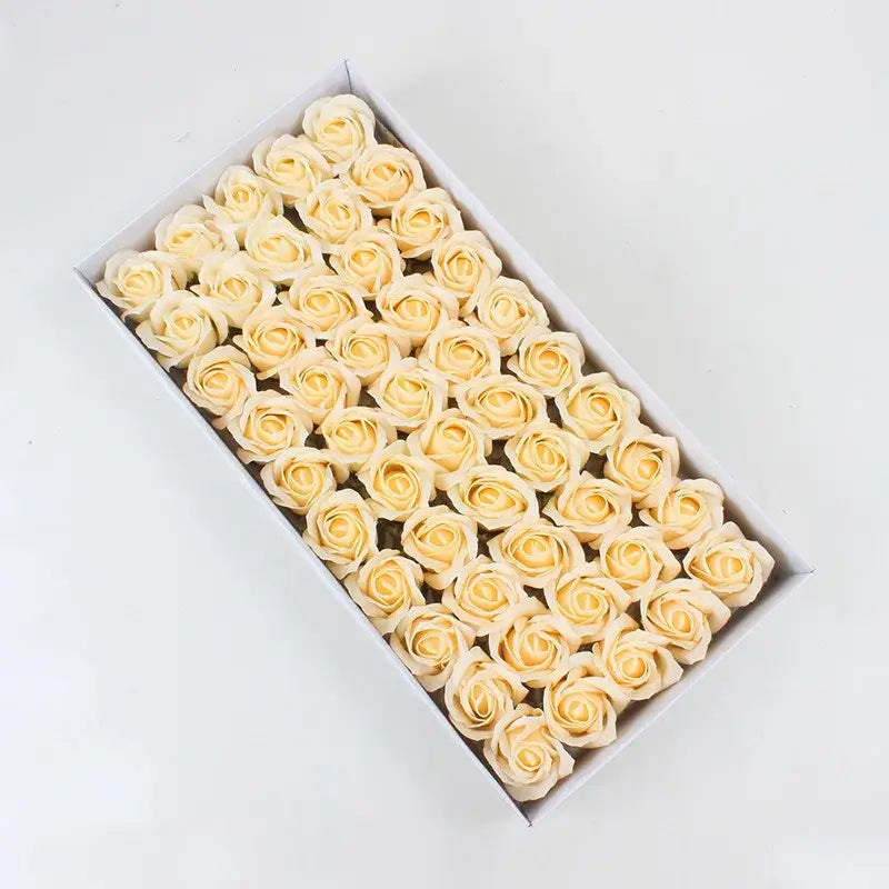 A box of cream-colored soap roses meticulously crafted in the decorbites bath flower set for elegant bathroom decor