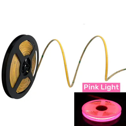 Vibrant slim 4mm cob pink led strip lights on a black spool with yellow flexible tubing ideal for bedroom linear tape lighting