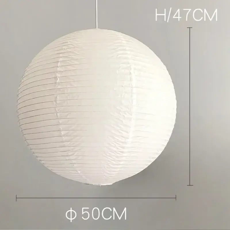 Vintage akari rice paper pendant light in white with vertical ridges and hanging string for bedroom or living room use