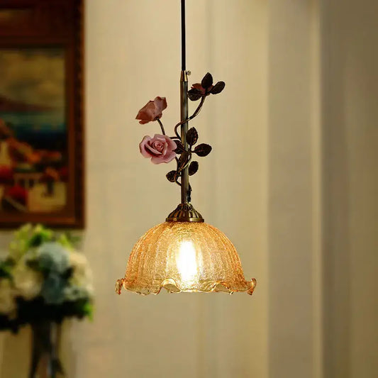 Vintage amber pendant light with crackled glass and bronze stem adorned with pink and dark rose blossoms french rose copper decorbites french rose