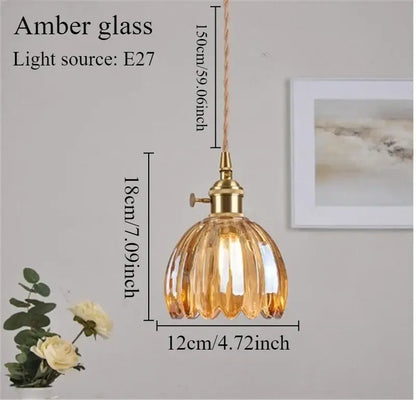 Vintage amber glass pendant light with brass fixture and ribbed globe featuring iron finish ideal for dining room