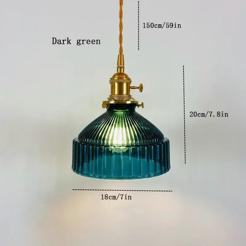 Dark green ribbed glass pendant light with brass fixture and twisted cord for vintage colored glass dining room lighting