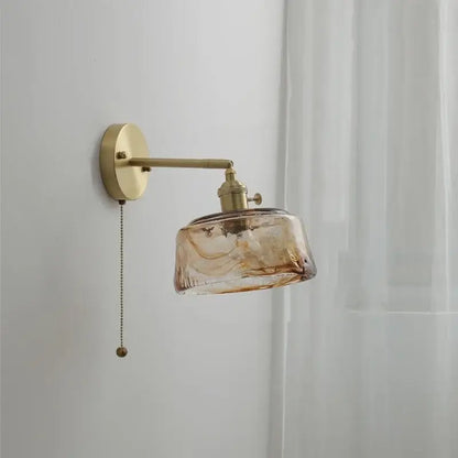 Vintage amber glass copper led wall lamp with brass arm and pull chain ideal for bedroom lighting