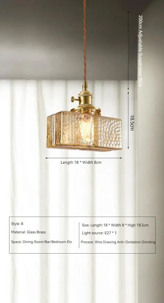 Vintage amber glass pendant light with a gold-toned textured hammered finish and polished brass hardware for dining room