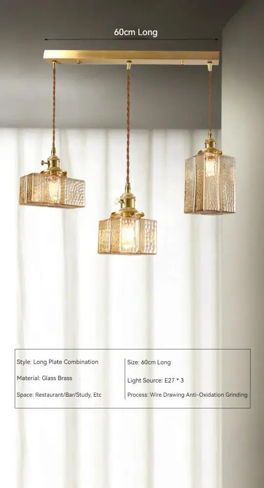 Vintage amber glass pendant light with gold-toned brass textured glass pendant lights on a 60cm bar for dining room