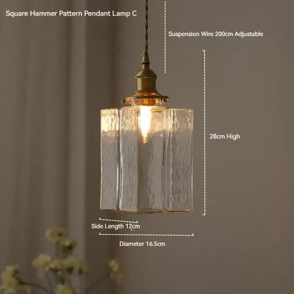 Vintage amber glass pendant light with translucent textured glass and polished brass hardware for dining room use