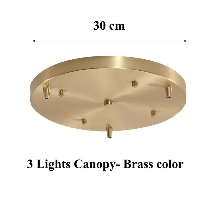 Brass-colored circular ceiling canopy with six mounting points for vintage amber glass pendant light for kitchen island