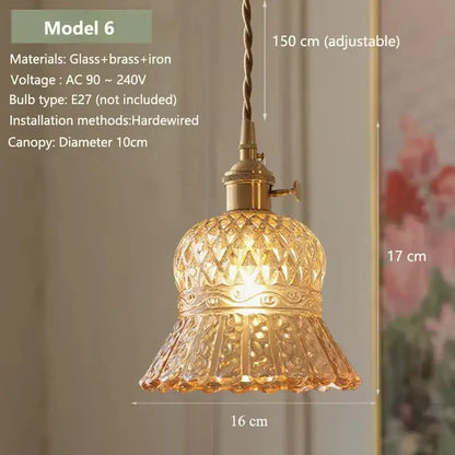 Vintage amber glass pendant light with brass metal fixture and patterned shade for kitchen island lighting