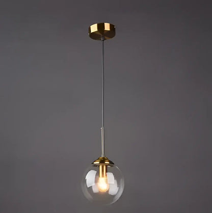 Vintage amber gold glass bubble chandelier with clear glass globe and polished brass accents for kitchen island decorbites glass bubble