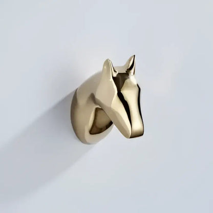 Gold-colored metallic horse head wall hook with sleek minimalist design for vintage brass robe hooks decorbites decorbites brass robe