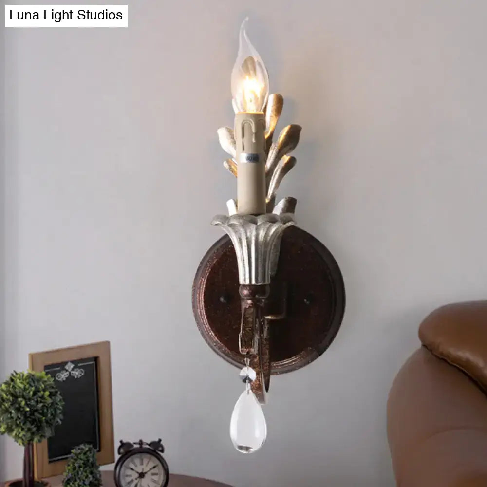 Vintage antique brass and silver leaf wall light fixture with amber glass candle bulb for bedroom sconce lighting