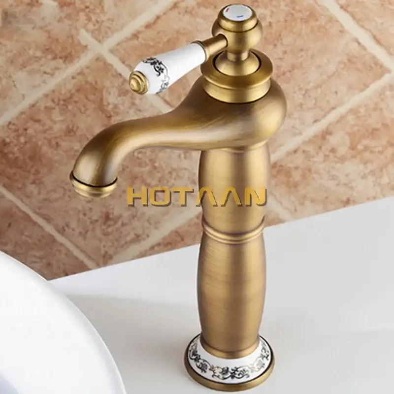 Vintage antique brass single hole bathroom faucet with cold water housing material and floral ceramic knob detailing