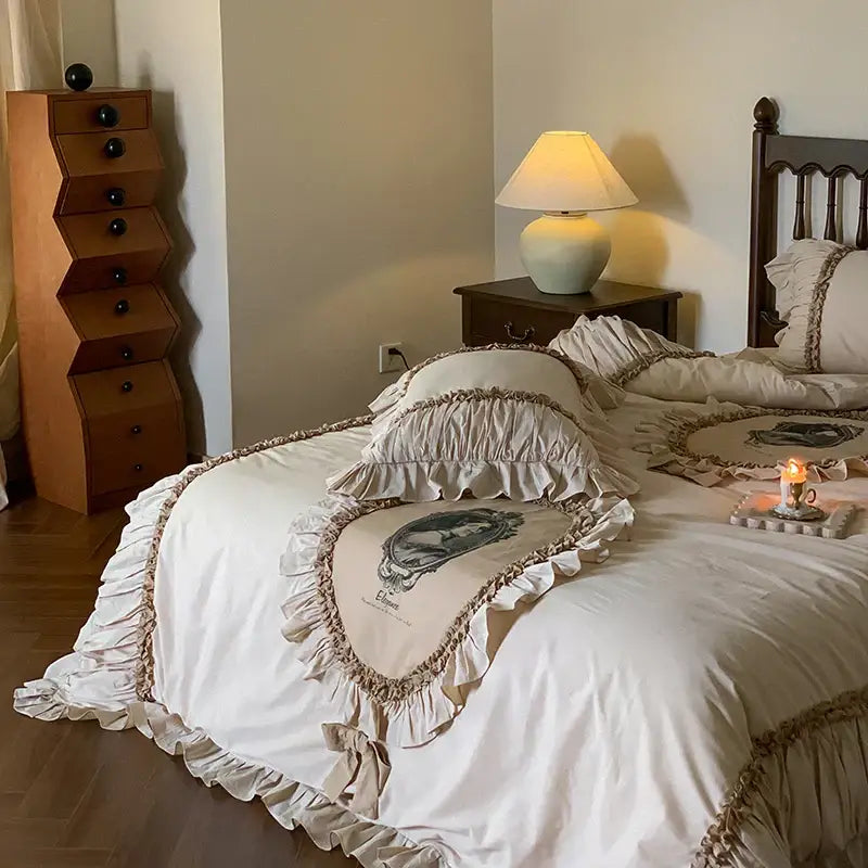 Cream-colored bedding set with vintage portrait embroidery and decorbites french lace ruffles for elegant bedroom decor
