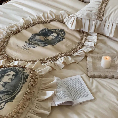 Cream-colored vintage beige bedding set with black and white portrait prints and decorbites french lace ruffles trim