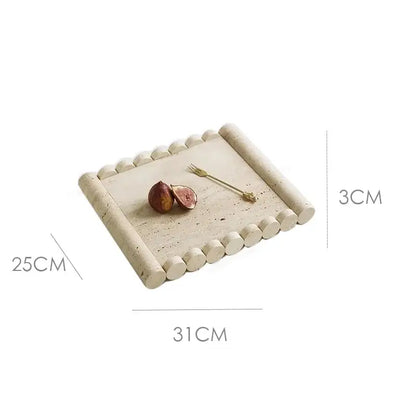 Rectangular serving tray made of beige travertine marble with rounded beaded edges and a speckled surface