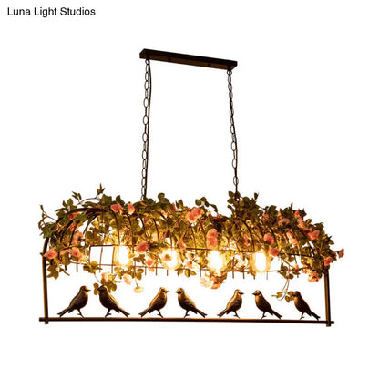 Vintage bird cage iron hanging light fixture with pink flowers green vines and six bronze bird figurines for dining room