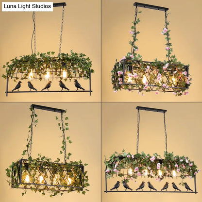 Black metal bird cage iron rectangular chandelier with hanging green ivy pink flowers and four exposed bulbs for dining room