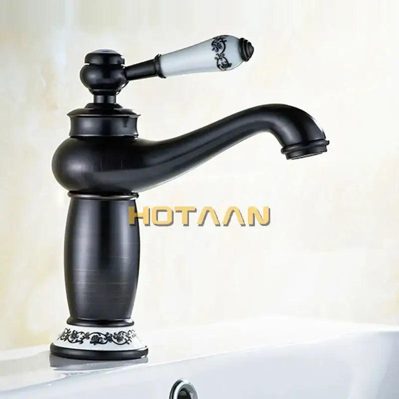 Vintage black brass ceramics bathroom faucet with ornate black floral ceramic handle and antique brass detailing base decorbites black brass