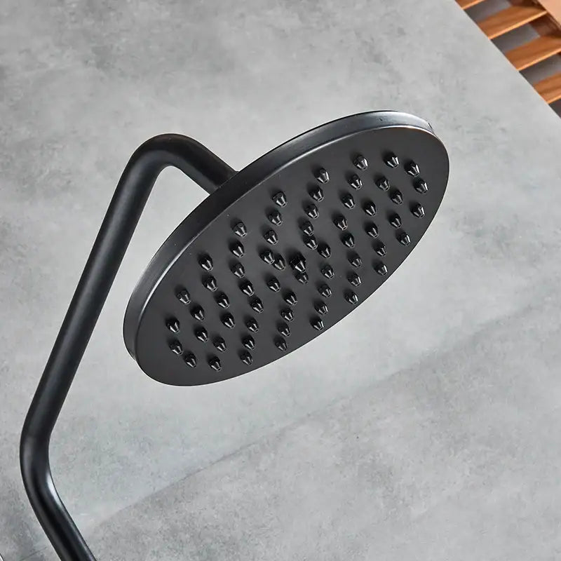Black matte-finish round showerhead with curved arm and multiple nozzles in vintage black bronze shower faucet set