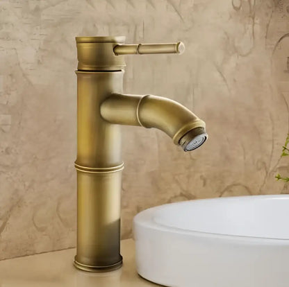 Antique brass vintage bathroom faucet with bamboo-style design single handle and curved spout for bathroom sink tap