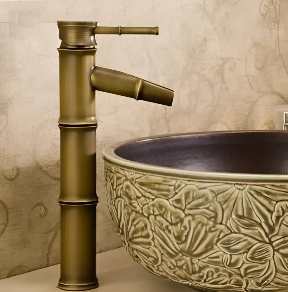 Antique brass vintage bathroom faucet with bamboo-style segmented design and matching spout for bathroom sink tap