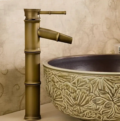 Antique brass vintage bathroom faucet with bamboo-style segmented design and matching spout for bathroom sink tap