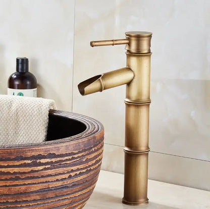 Antique brass bamboo-style vintage bathroom faucet with curved spout in vintage black and copper for bathroom sink