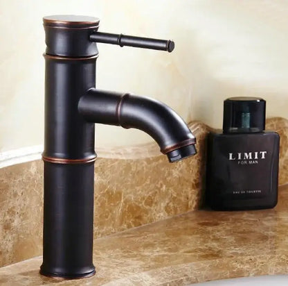 Vintage bathroom faucet in black bamboo style with copper accents designed for bathroom sink use