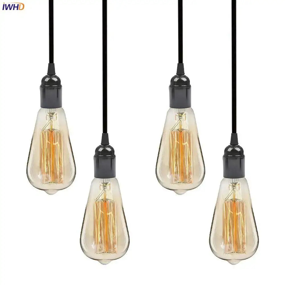 Four vintage-style edison filament pendant lights with clear glass bulbs and black e27 socket bulb holders emitting warm amber glow