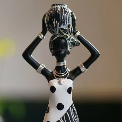 Vintage black and gold african women resin figurine with polka dot dress silver jewelry carrying striped vessel for decorbites african women decor