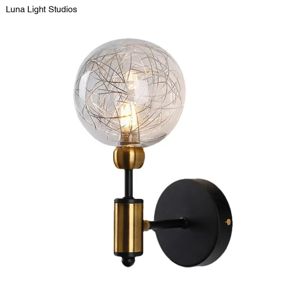 Vintage black and gold clear glass wall sconce with spherical bulb and intricate wire detailing for e26 e27 bulbs