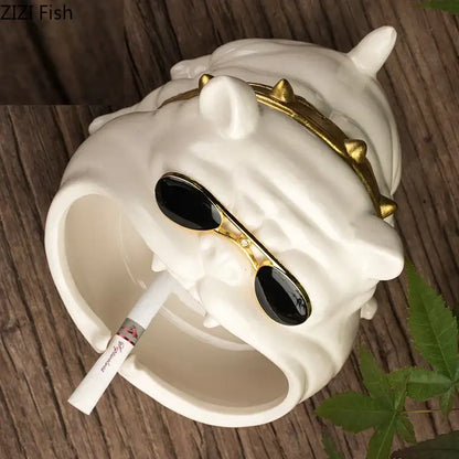 White ceramic dog ashtray with gold spiked collar and black sunglasses from decorbites ceramic dog collection for living room decor