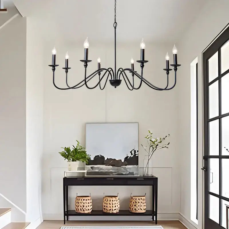 Vintage black and gold metal pendant light with candle-style bulbs designed as a dining room chandelier