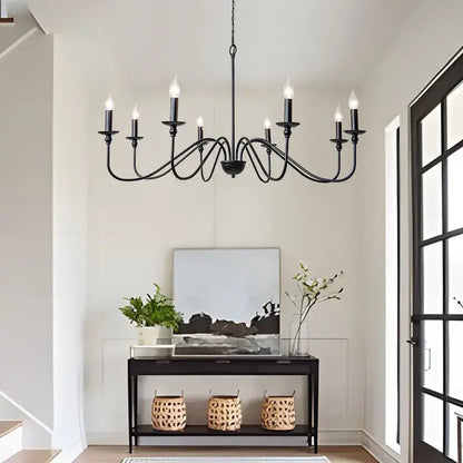 Vintage black and gold metal pendant light with candle-style bulbs designed as a dining room chandelier