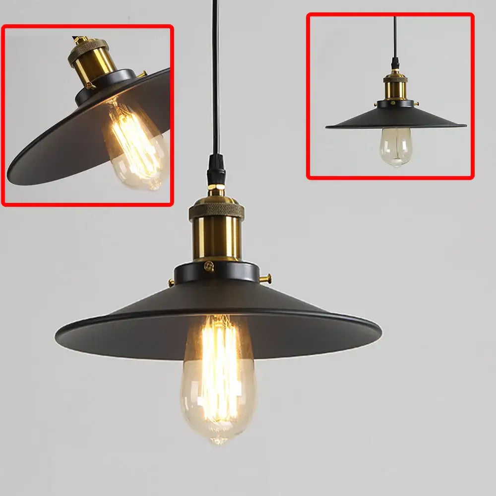 Industrial-style black iron pendant light with brass-finished fixture and exposed edison bulb for kitchen use