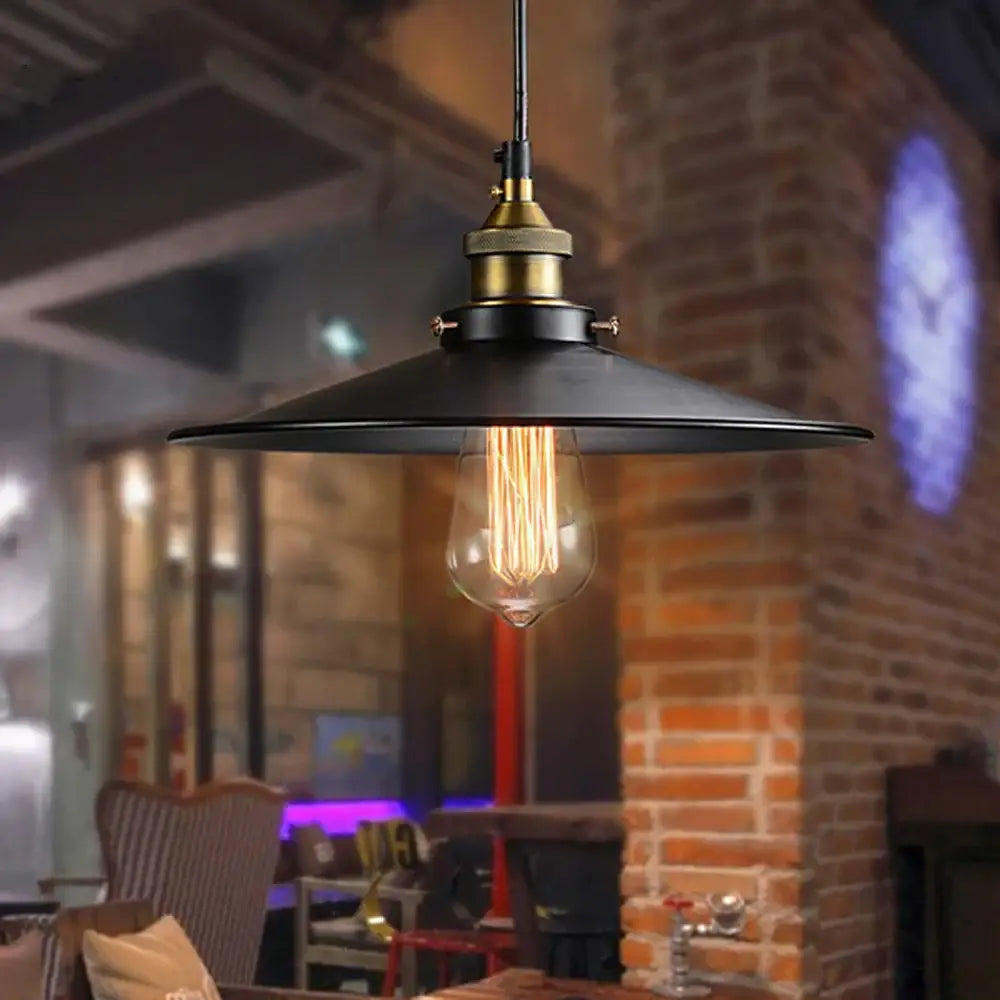 Vintage black iron pendant light with black iron finish brass socket and exposed Edison bulb for kitchen lighting