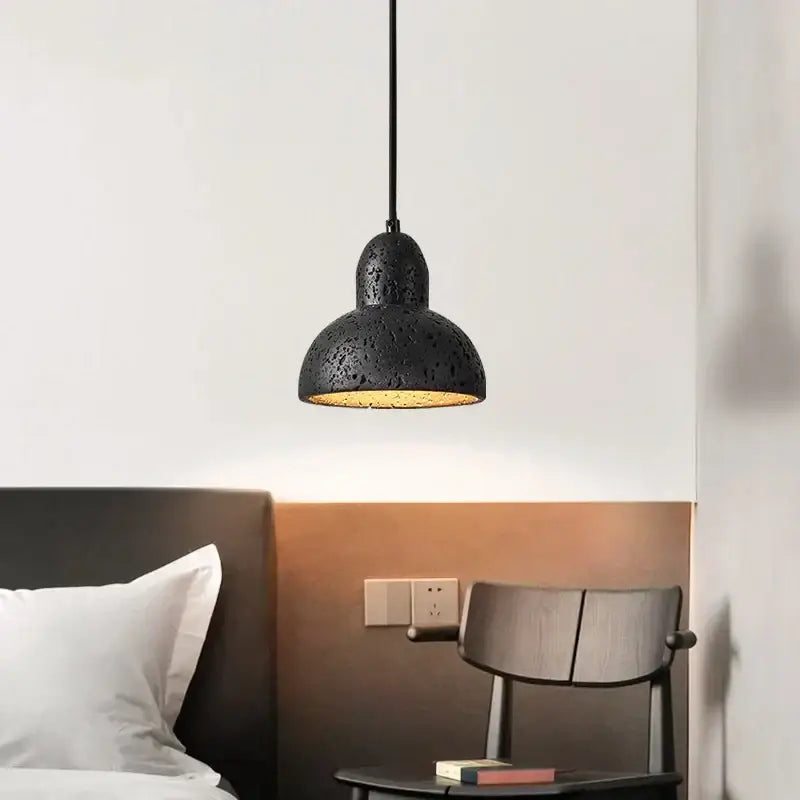 Vintage black travertine led pendant light with textured speckled matte finish and warm interior for living room decorbites black travertine