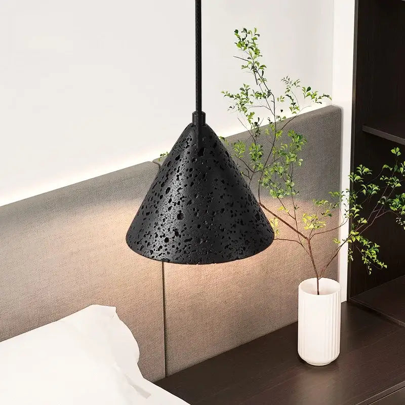 Black textured cone-shaped pendant light with matte perforated surface vintage black travertine led for living room decorbites black travertine